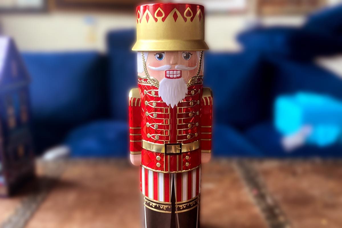 A red nutcracker-shaped tin of chocolate truffles