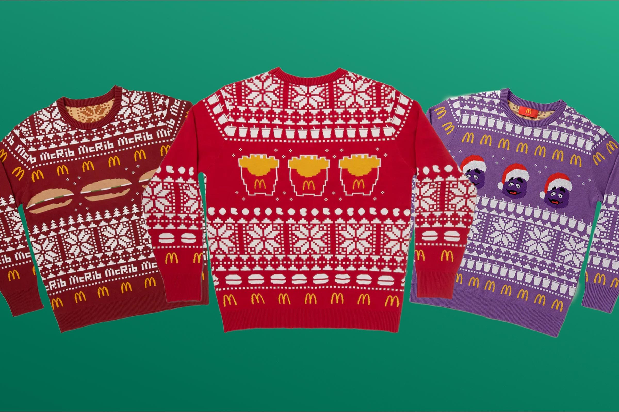 Three Ugly Christmas Sweaters With McDonald's Branding On A Green Background