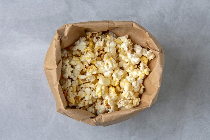 popcorn inside brown paper bag