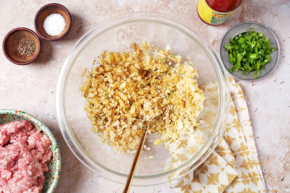Onion, garlic, bread crumbs, egg and soy sauce in a large mixing bowl.