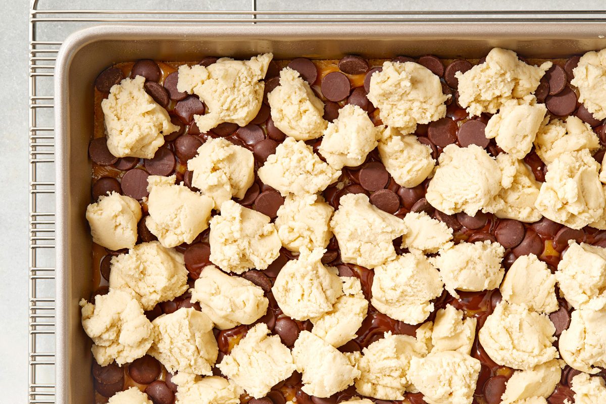 teaspoonful dough dropped over the top of the chocolate caramel filling