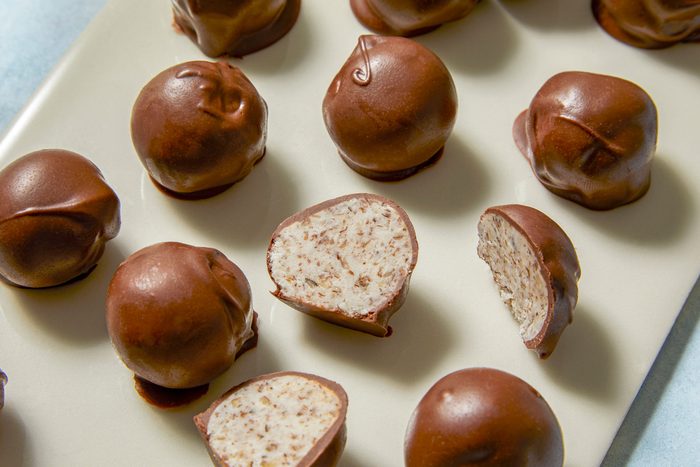 Chocolate Bonbons full and half placed on a white surface