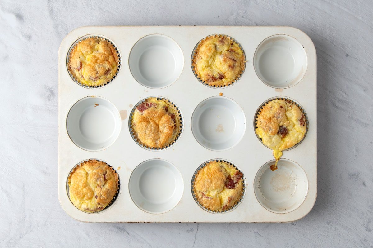 Bake until the eggs puff and are cooked to desired degree of doneness,