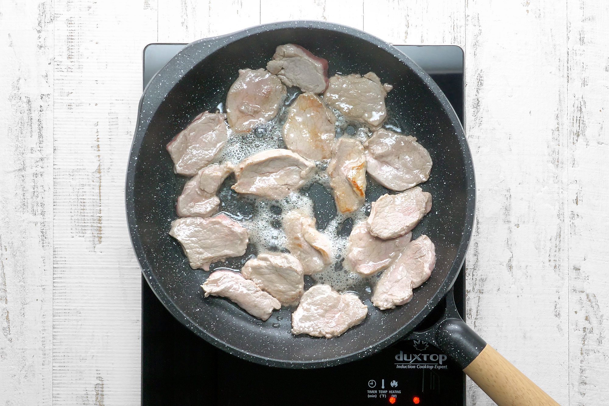 In a large nonstick skillet or wok, stir-fry pork