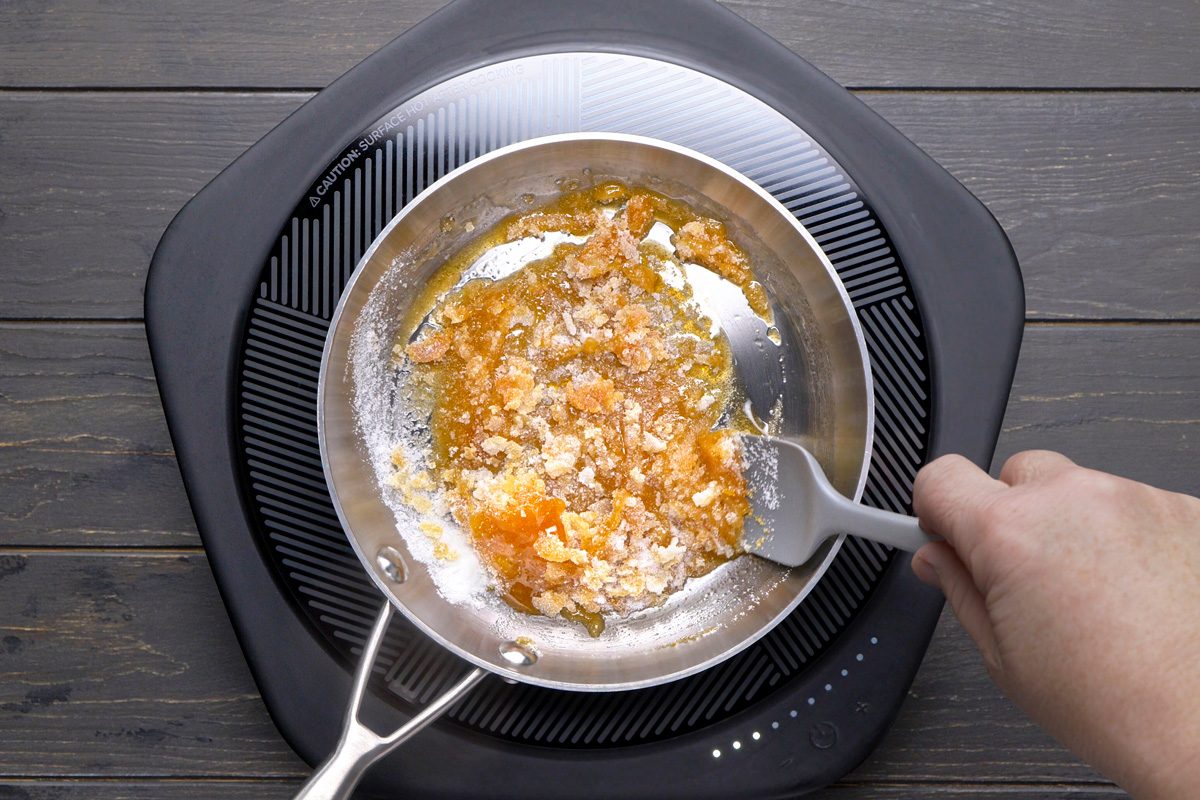 sugar being cooked in a skillet 