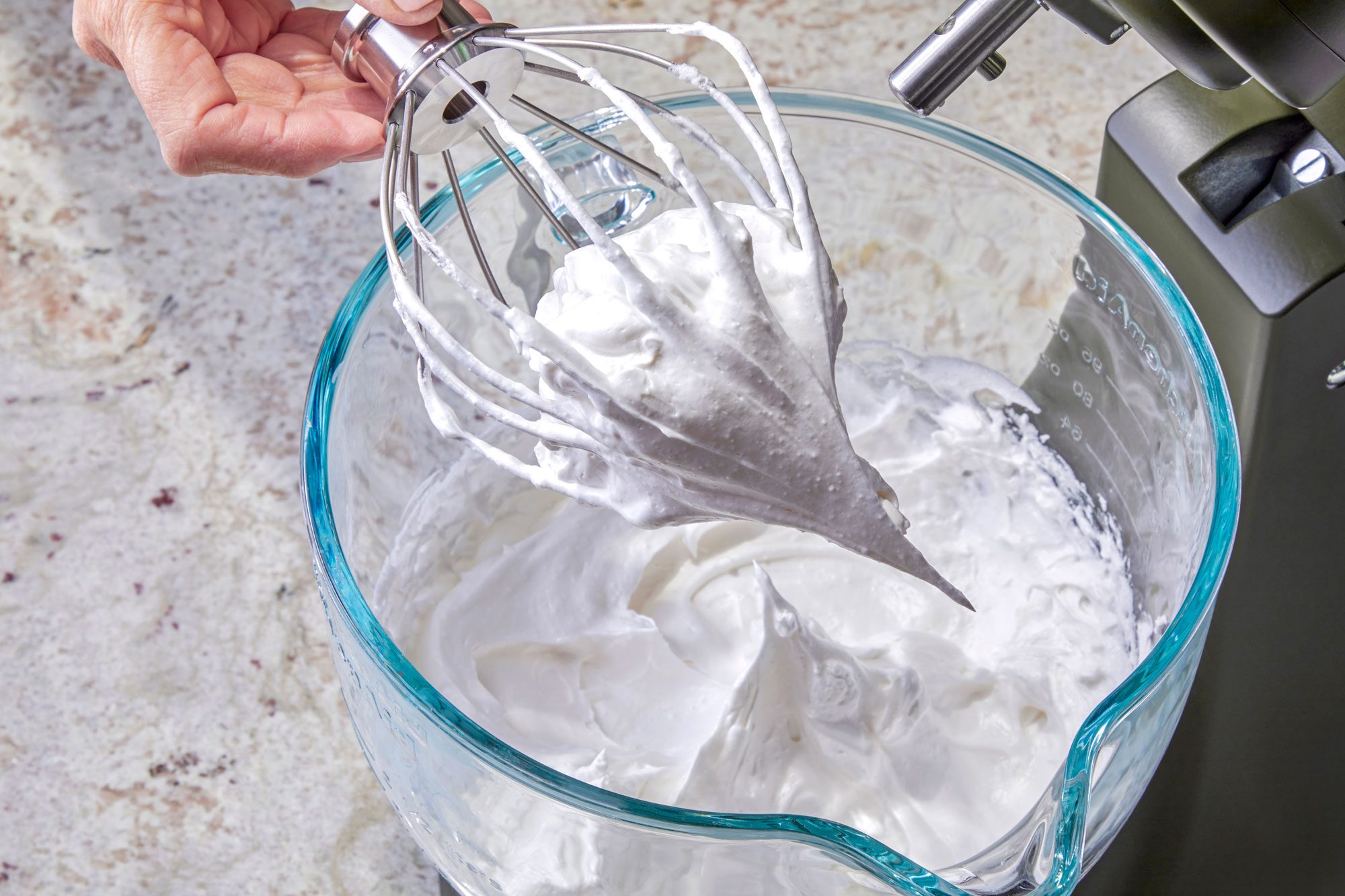 Beating on high until stiff glossy peaks form and sugar is dissolved