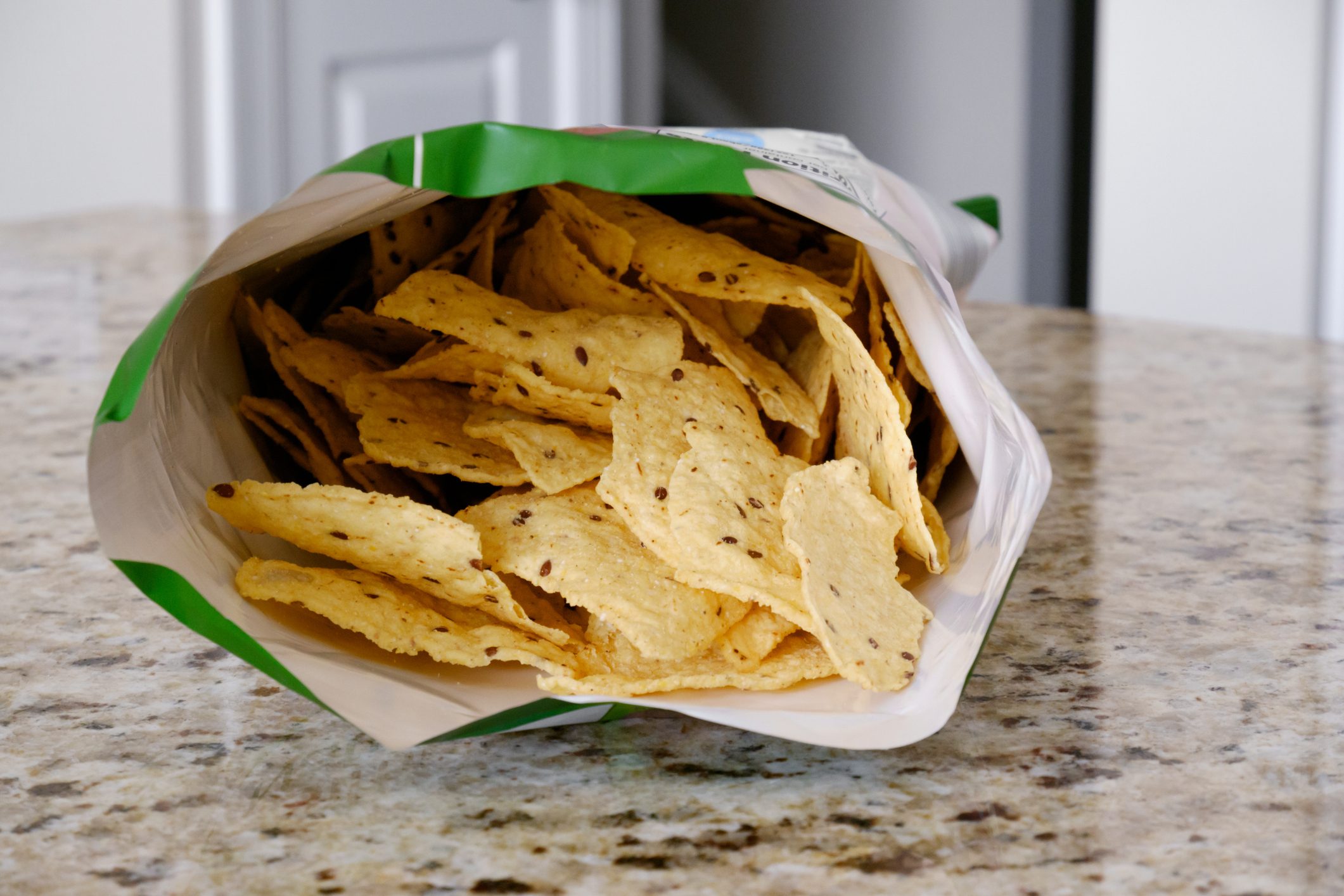 Open Bag of Multigrain Tortilla Chips on Kitchen Counter