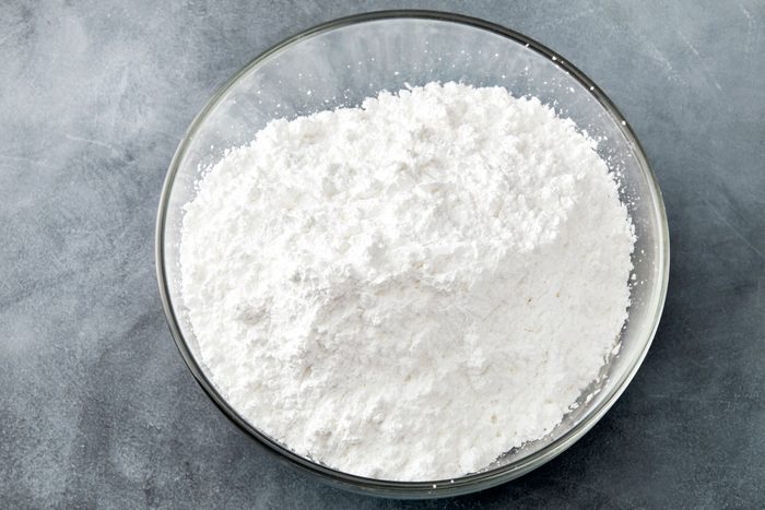 In a large bowl combine the flour; confectioners sugar and baking powder