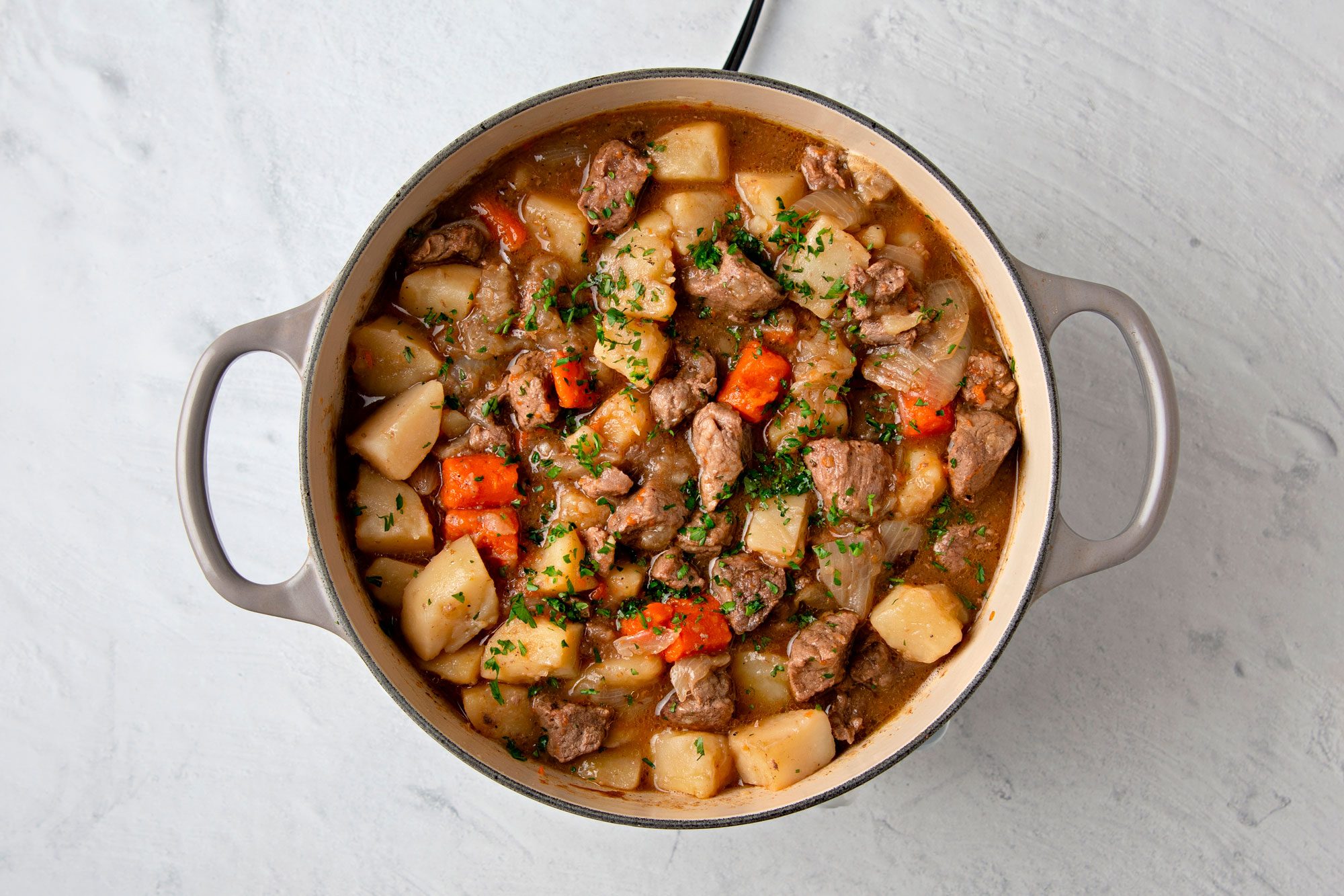 Stir in the parsley, chives, thyme, and meat and vegetables; heat through.