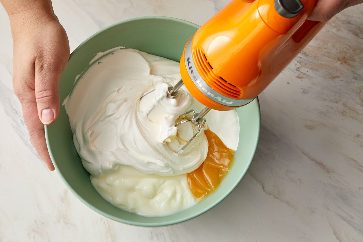 Beat together yogurt, whipped topping, marshmallow creme and lemon curd.