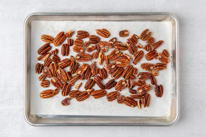pecans on a baking sheet