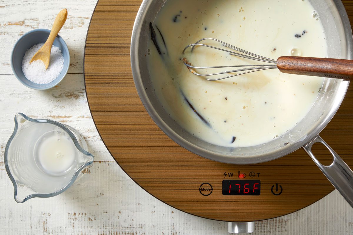Overhead shot of add remaining ingredients to pan; cook and stir over medium heat until heated through 5-7 minutes; whisk tool; wooden surface;