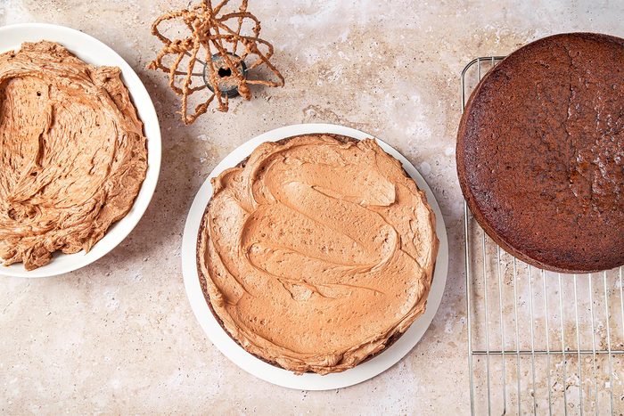 Cake assembled with chocolate frosting.