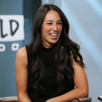 Joanna Gaines wearing a black dress and smiling
