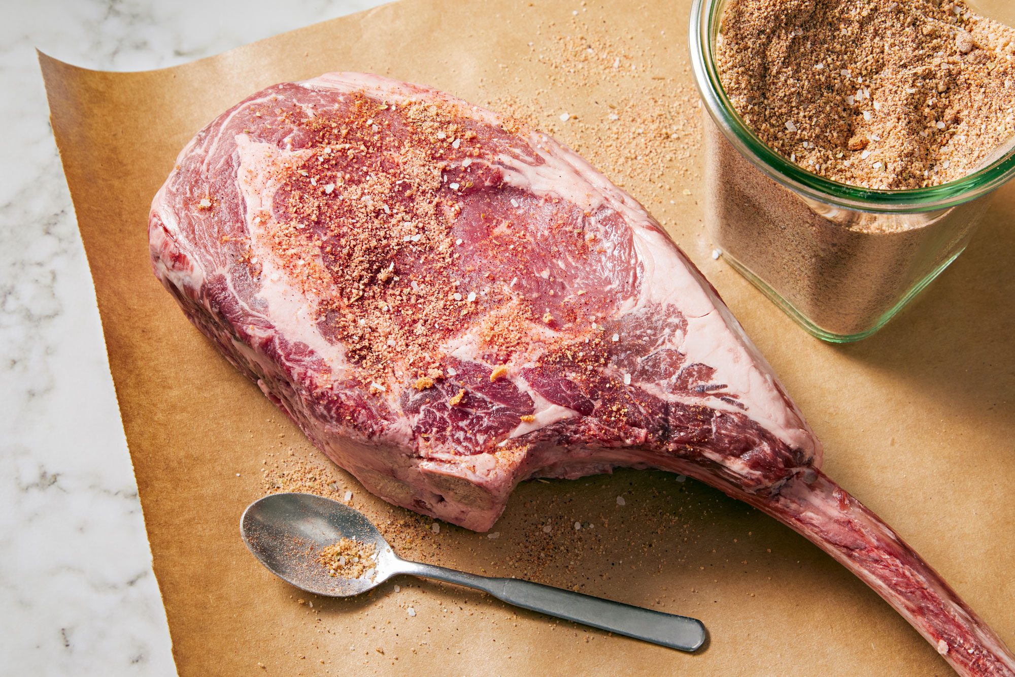 Raw steak seasoned with dry rub