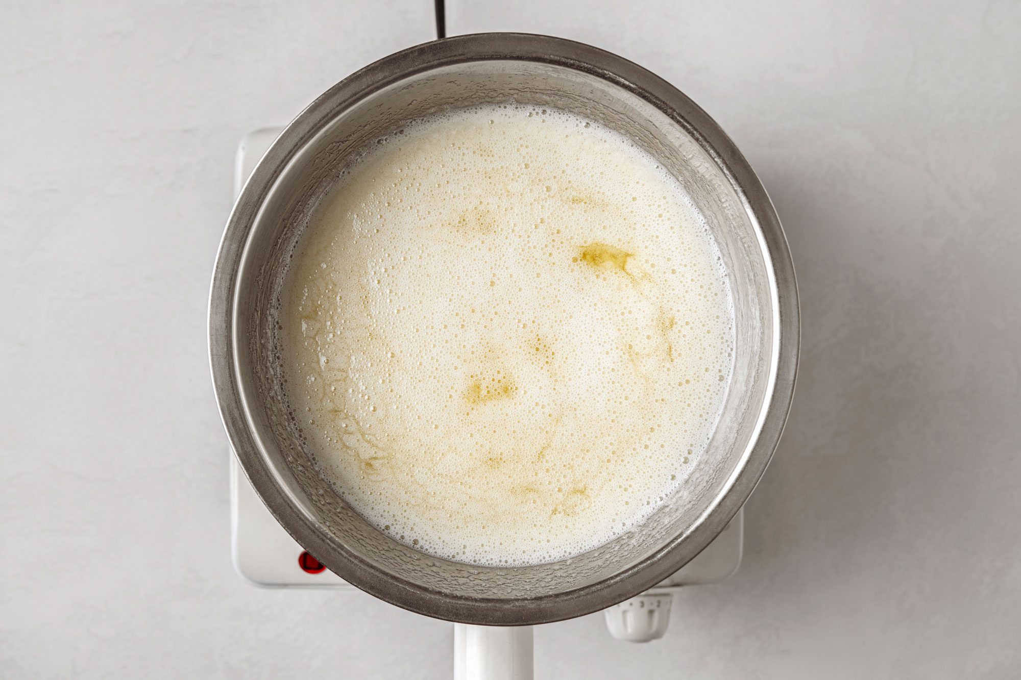 Place egg whites in metal bowl over simmering water and stir in the sugar mixture
