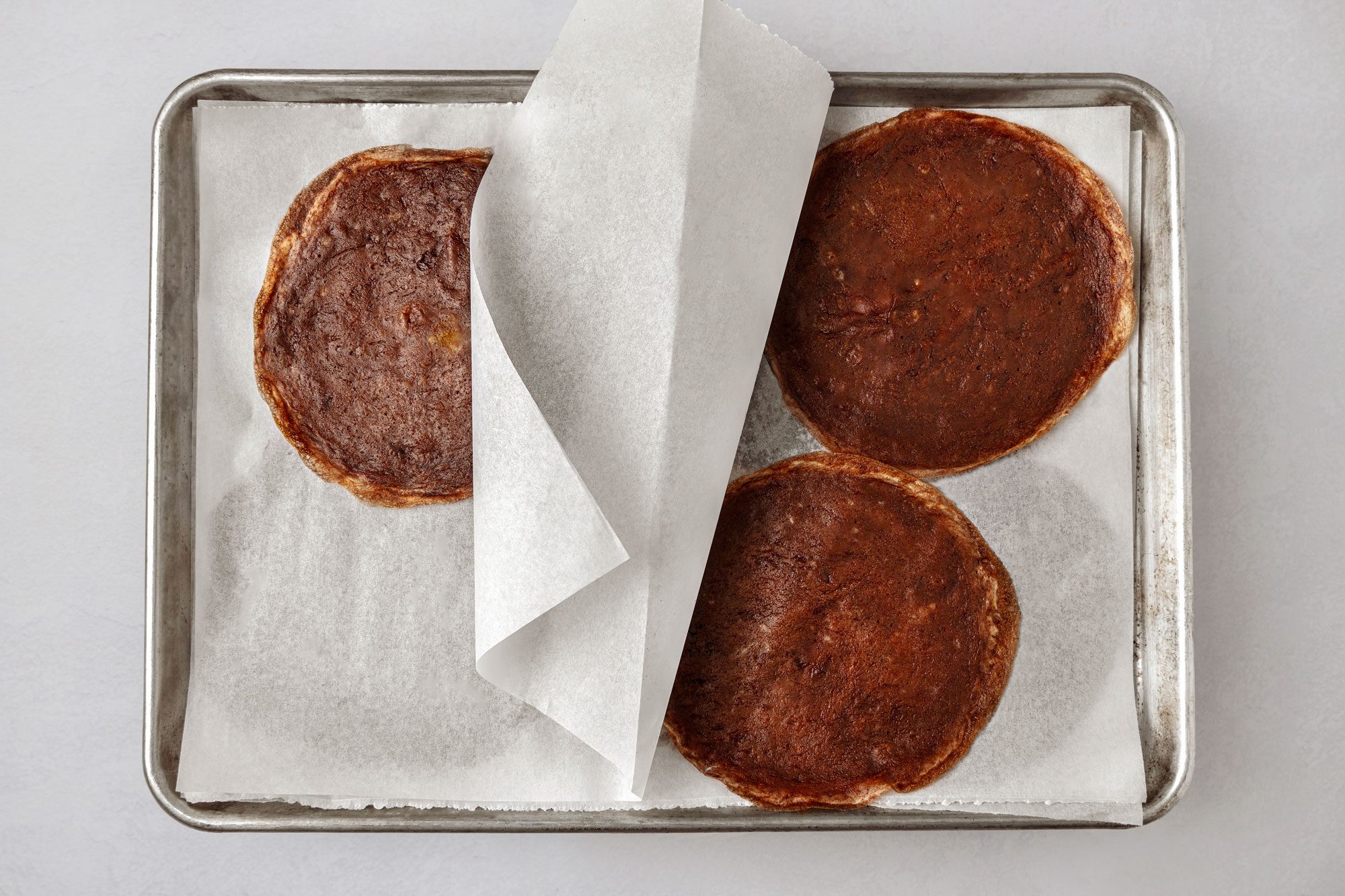 Place one crepe on a cake plate spread with 3 tablespoons buttercream