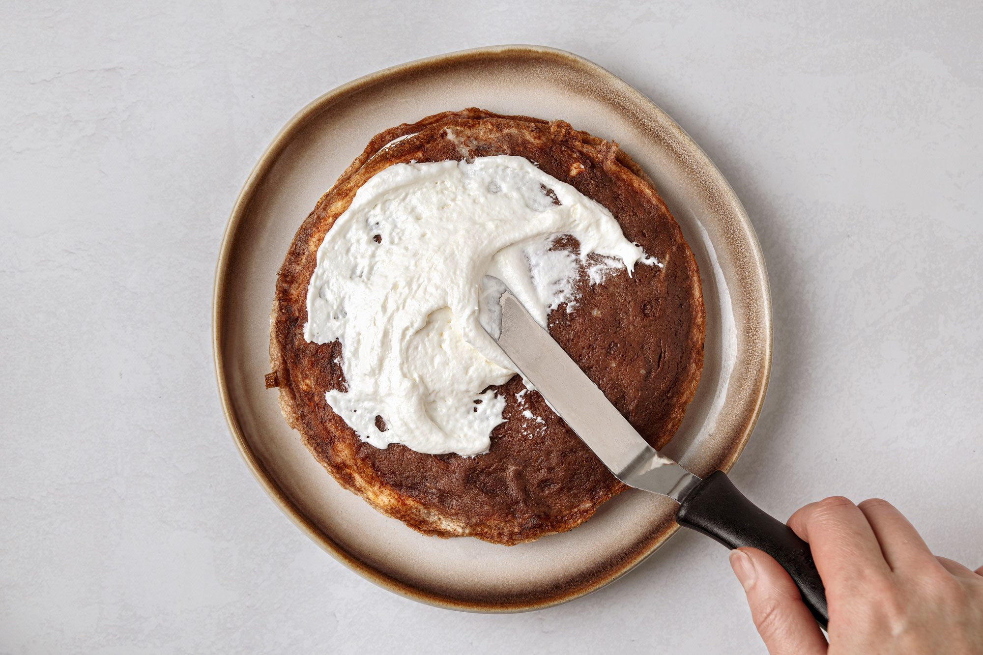 Spread with 3 tablespoons buttercream and repeat the layering
