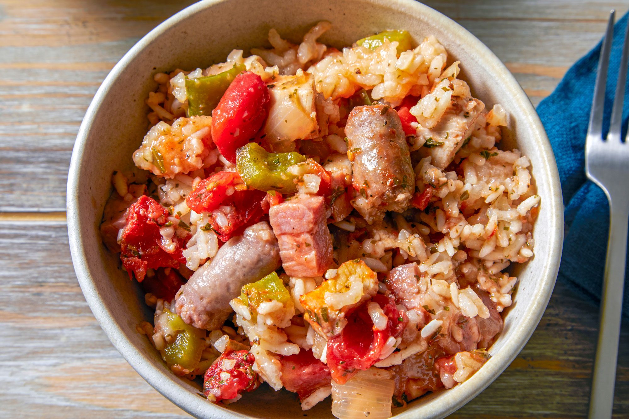 Sausage Jambalaya served in a bowl with fork on the side
