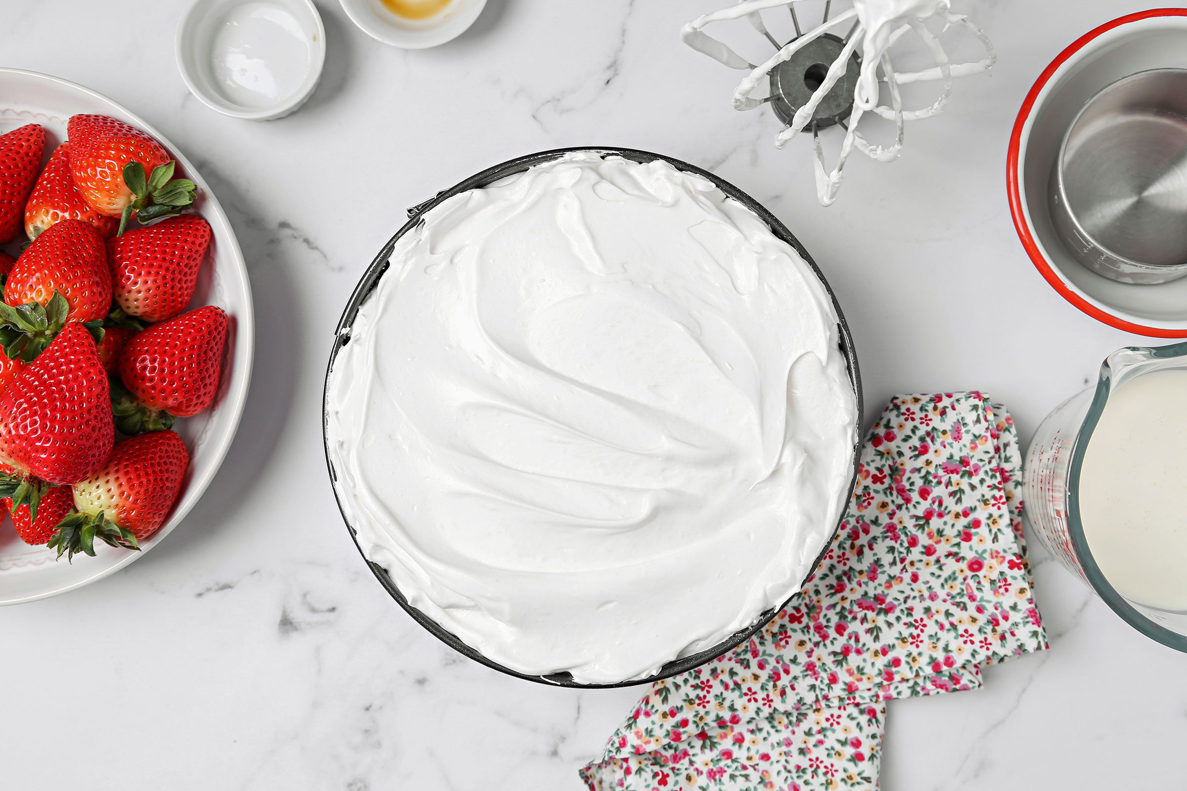 Schaum Torte batter spread into a 10 inch springform pan