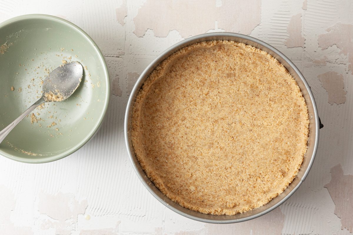 Overhead shot of a small bowl with mixed wafer crumbs, sugar and butter