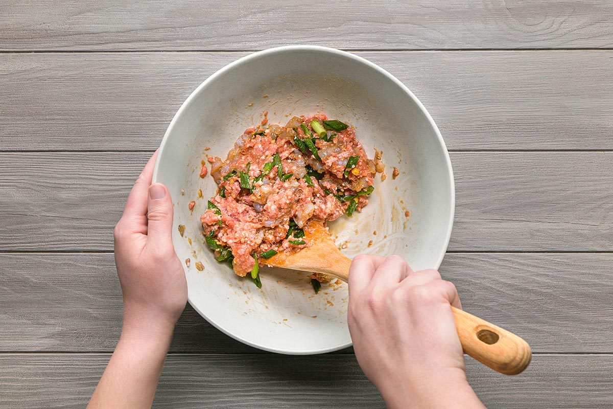 Wonton Soup filling ingredients being combined in a bowl