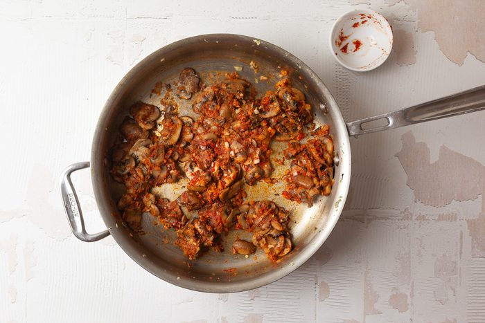 light brown onion and mushroom mixture in a pan