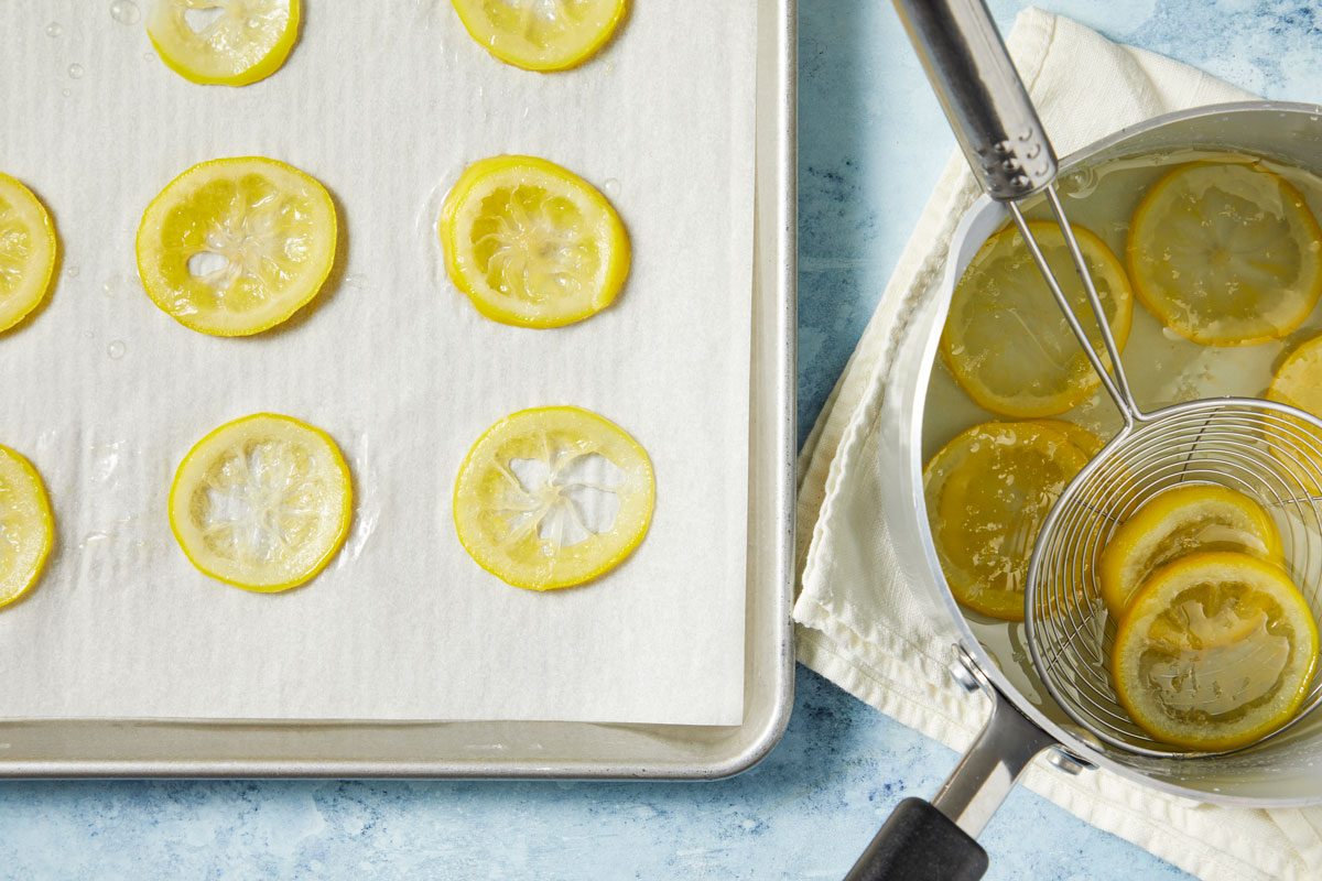 Remove lemon slices with a slotted spoon; line in a single layer on a 15x10x1-in. sheet pan lined with parchment paper; discard liquid.