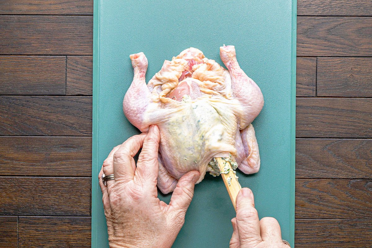 rubbing butter under hen's skin