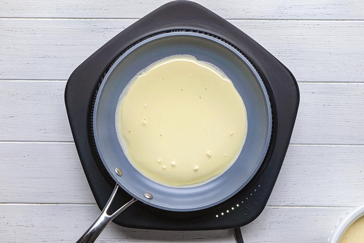 Crepe Cake being cooked on a pan.