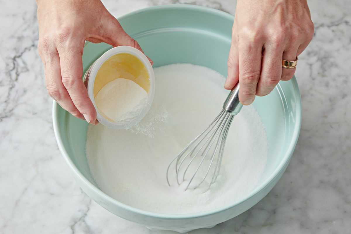granulated sugar and meringue powder combined in a bowl