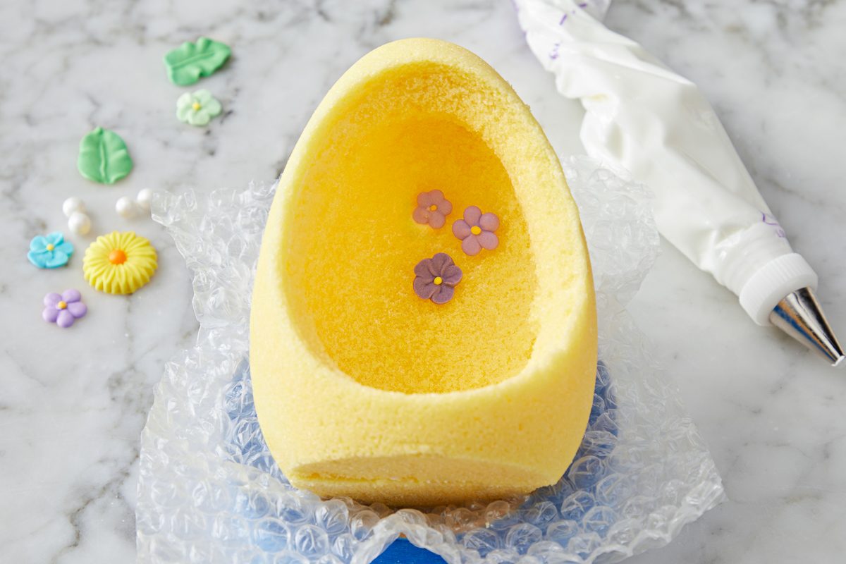 egg propped in cradle for decoration