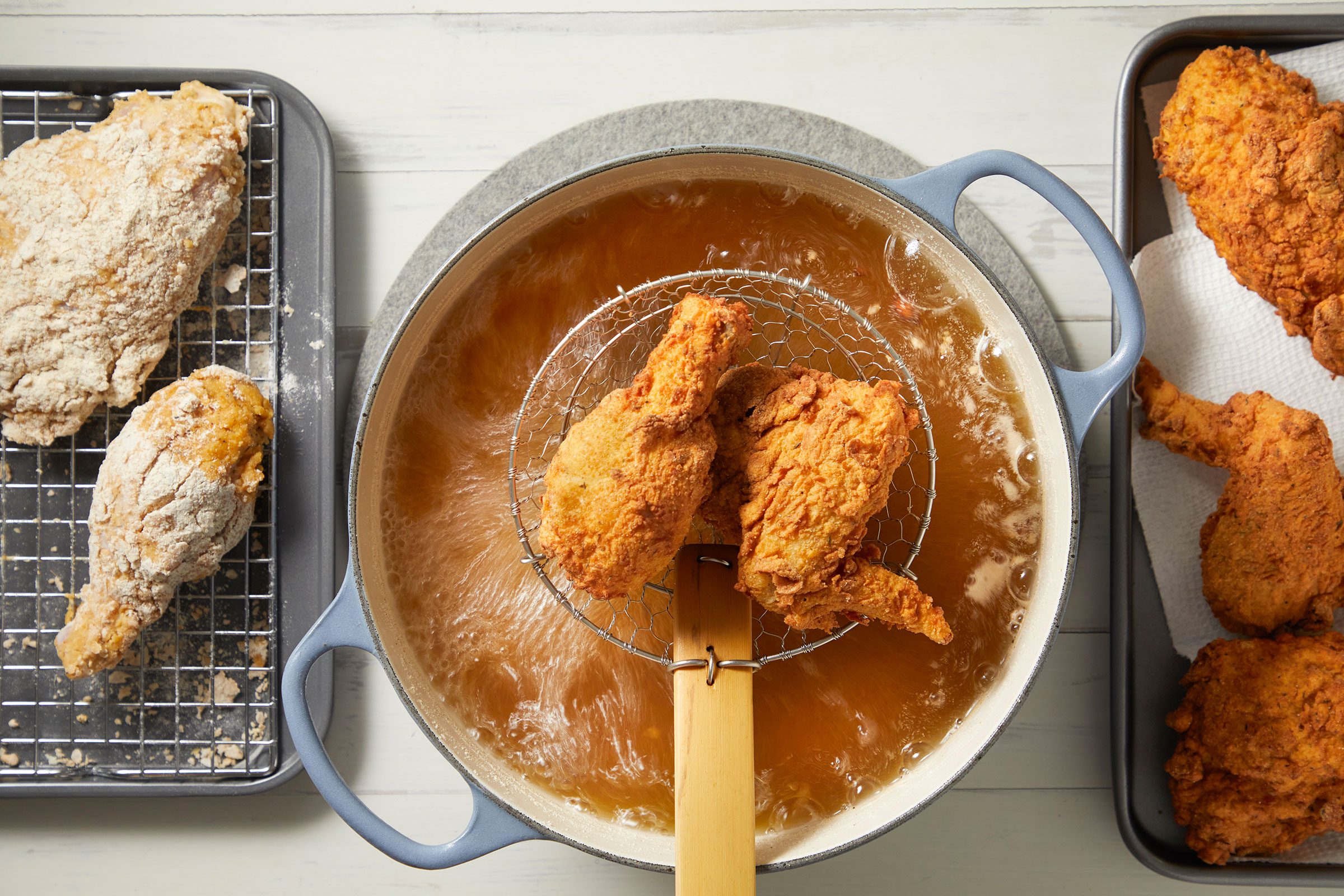 Frying battered chicken in hot oil in a dutch oven