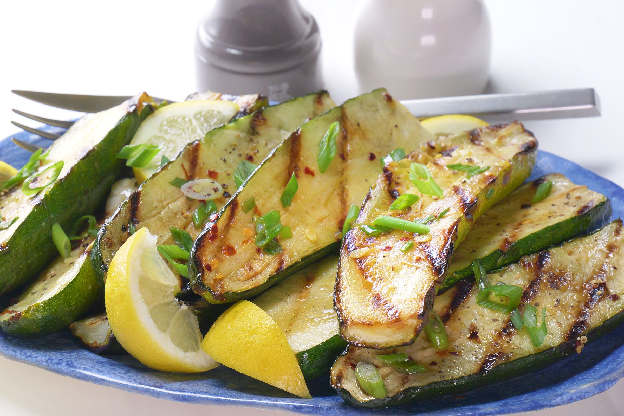 Grilled Zucchini with lemons on a plate