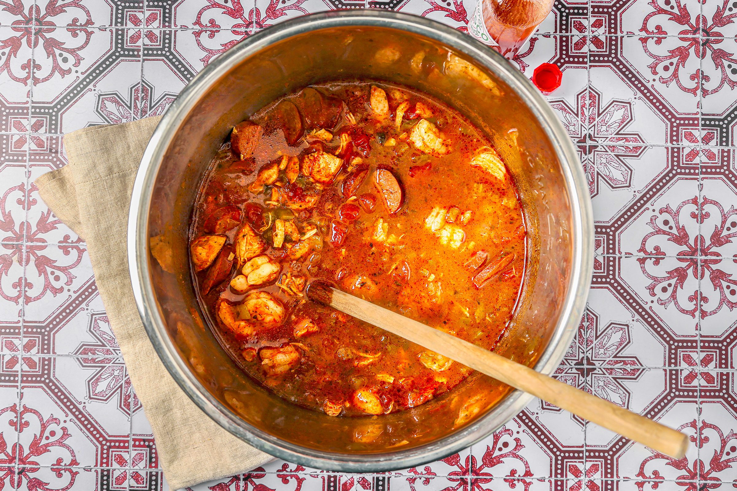 Stirred in shrimp in cooking Jambalaya in a slow cooker