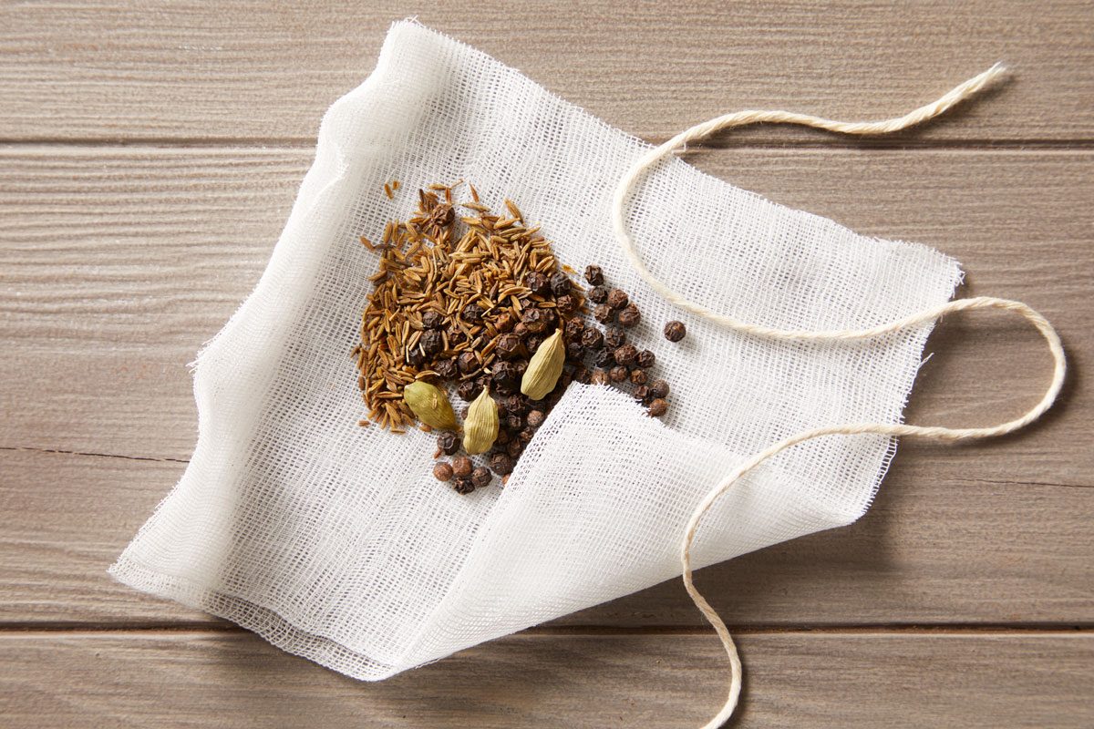 Place peppercorns, cardamom pods and cumin seeds on a double thickness of cheesecloth