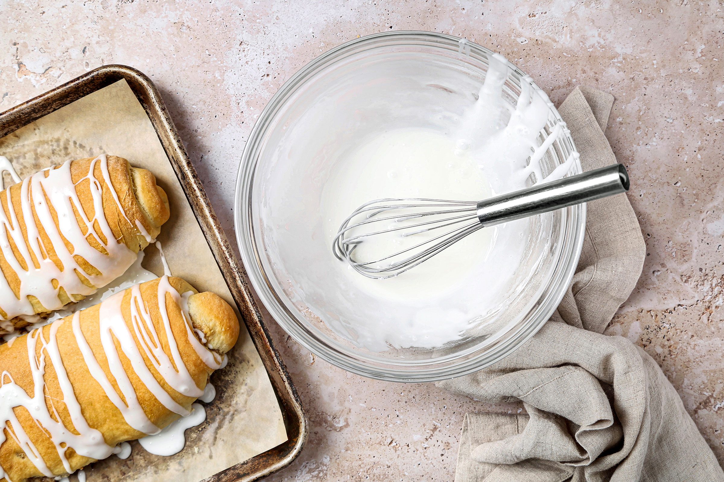 Combine milk and confectioners’ sugar to make a simple icing and then drizzle it over the nut rolls in an attractive pattern
