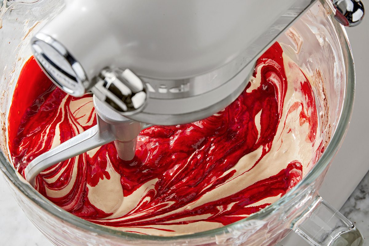 Close shot of stir in food coloring; marble surface