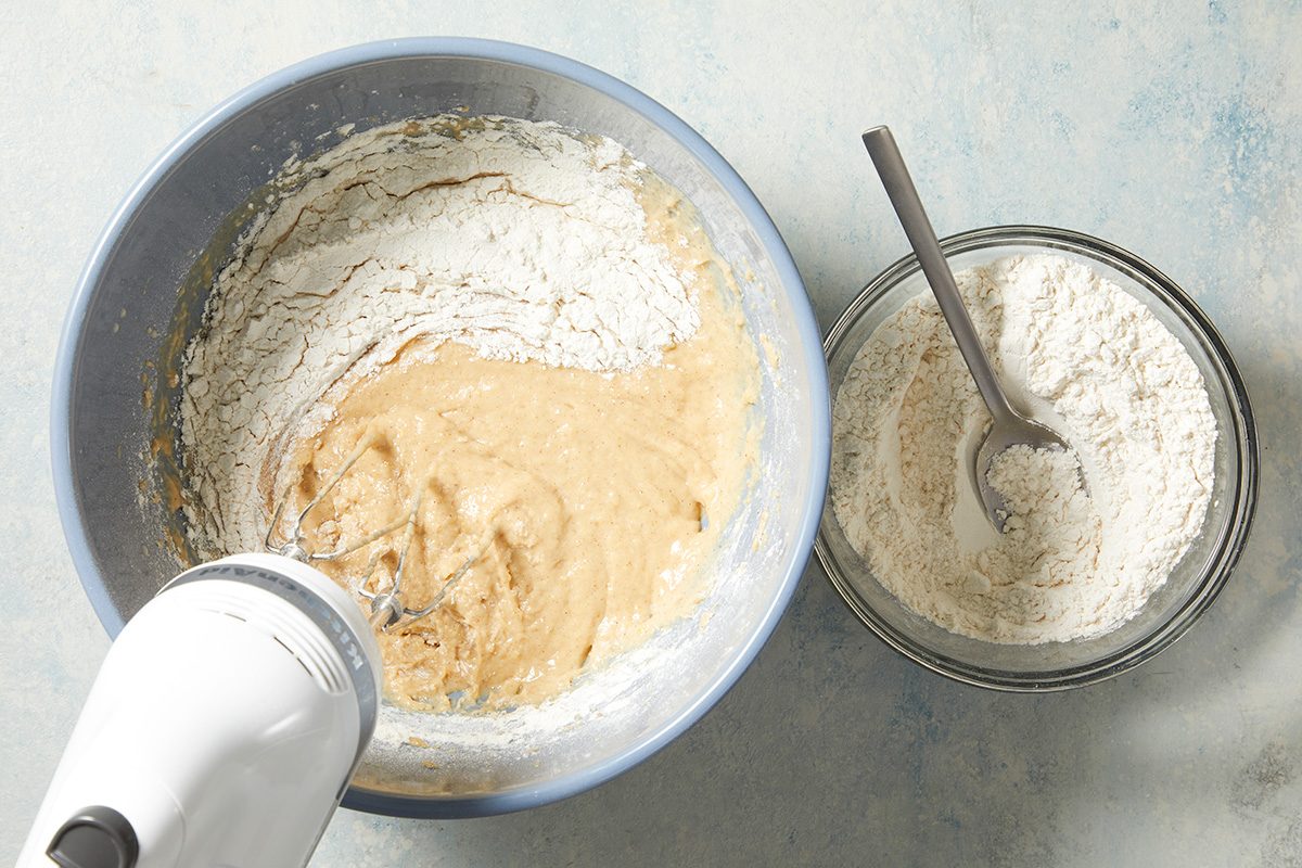 Overhead shot of beat on medium speed 2 minutes; Stir in 3-3/4 cups additional flour; adding remaining 1/2 cup if needed to form a soft dough