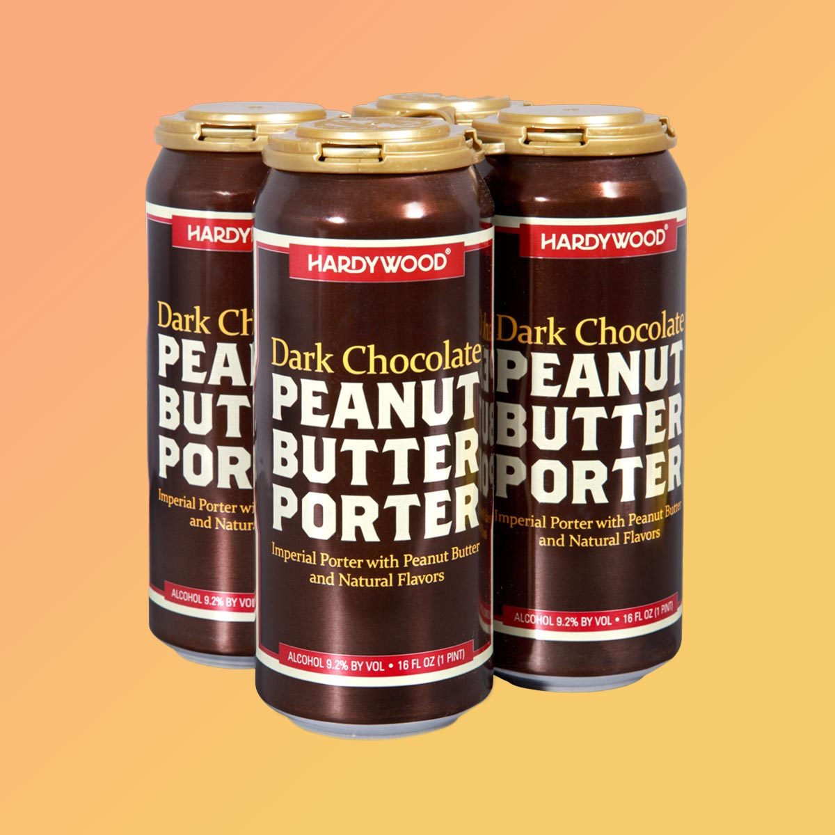 Cans of Trader Joes Chocolate Peanut Butter Porter on an orang ebackgorund
