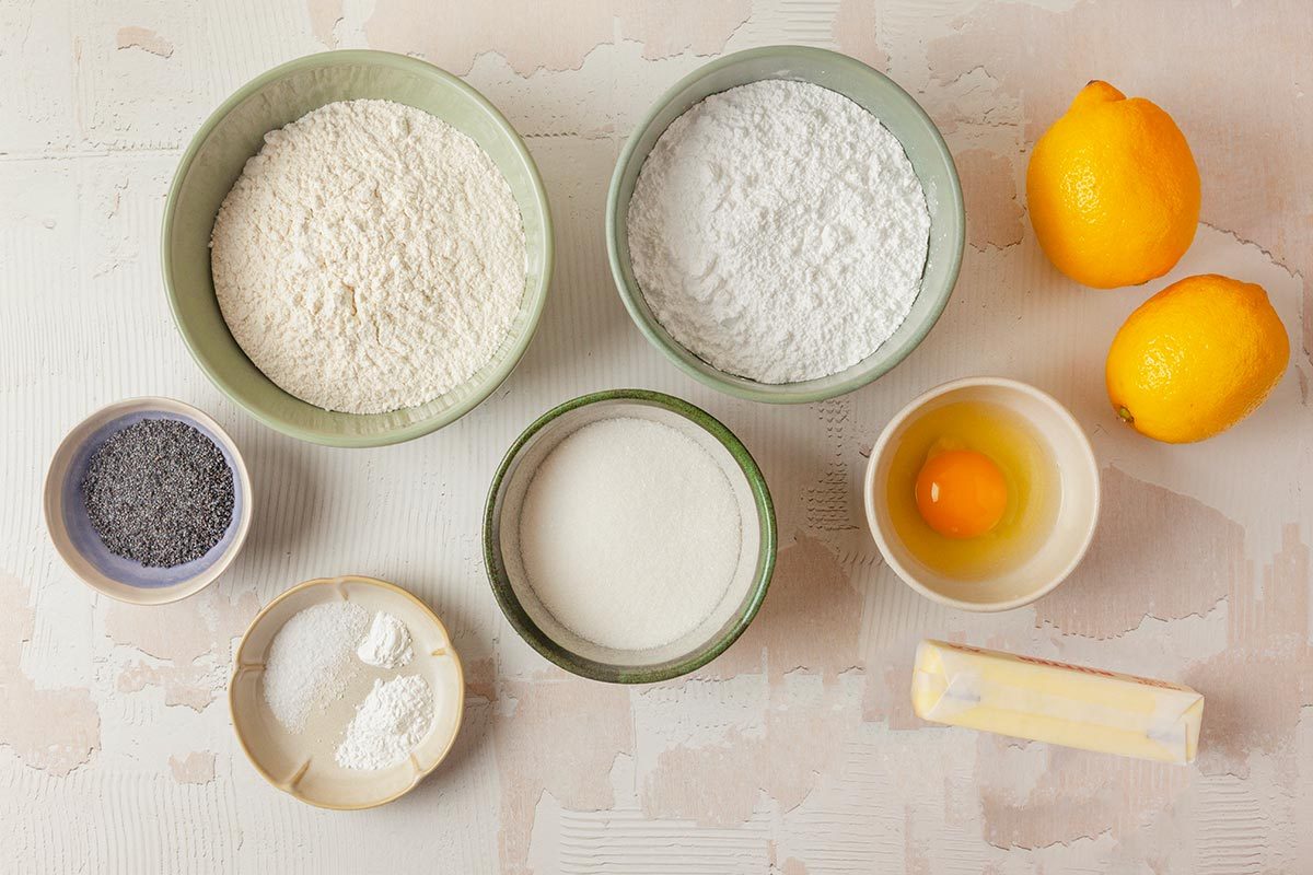 Lemon Poppy Seed Cookies ingredients placed over light textured background