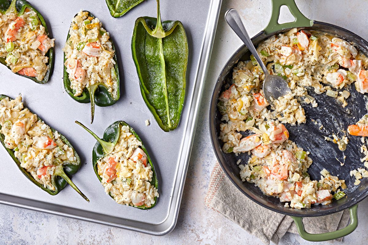 peppers stuffed with hot filling with skillet next to them