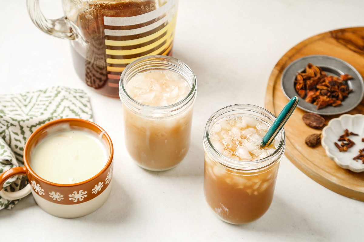 tea mixture added to glasses filled with ice