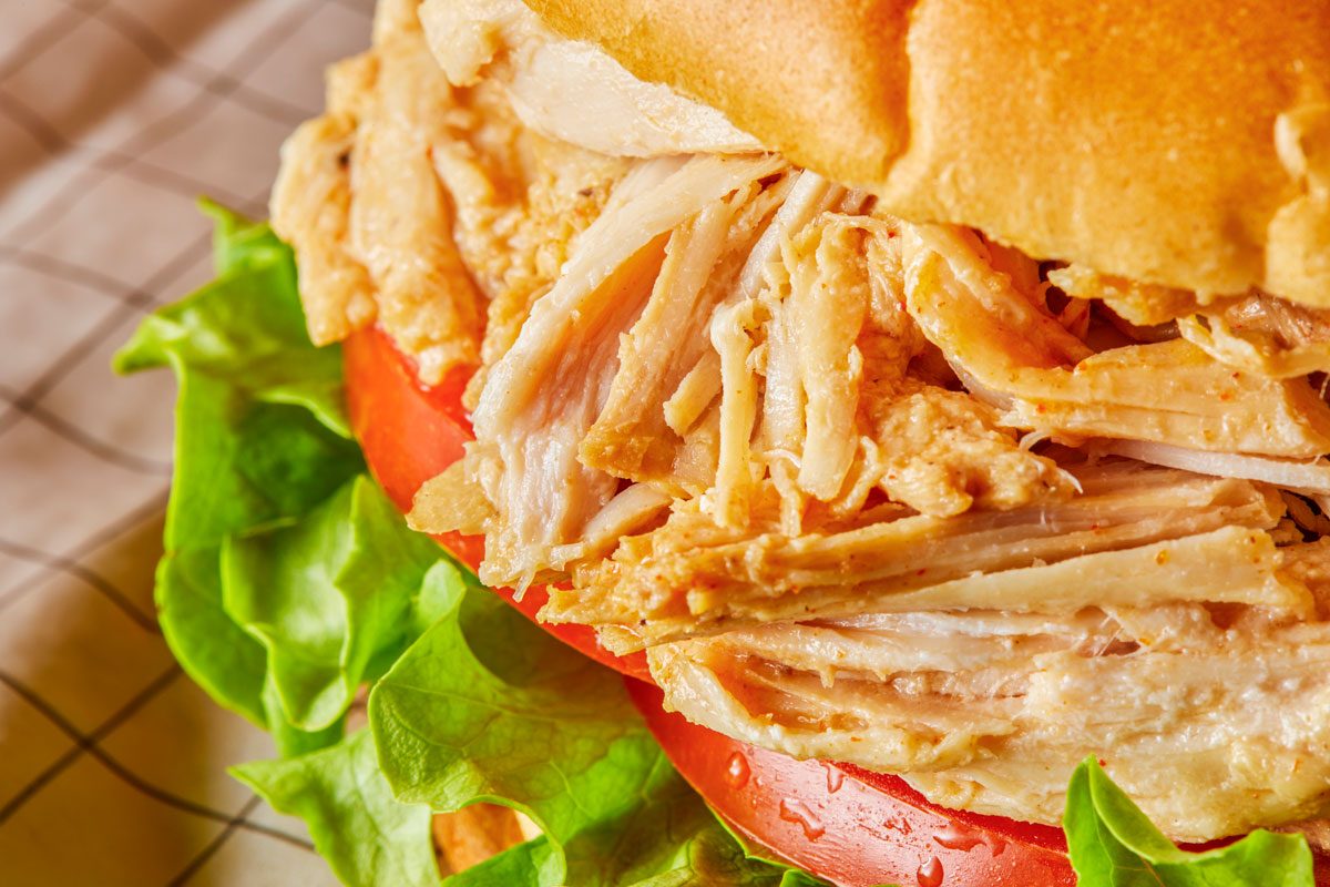 Close-up shot of Turkey Barbecue; served on a wooden tray;