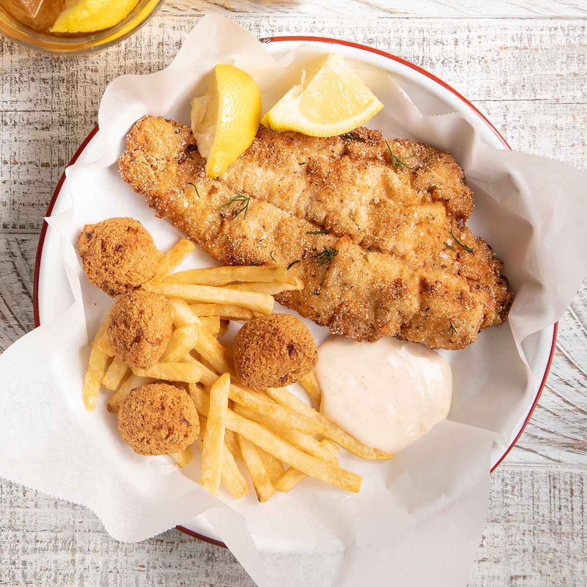 Fried Catfish served on a table along with fries