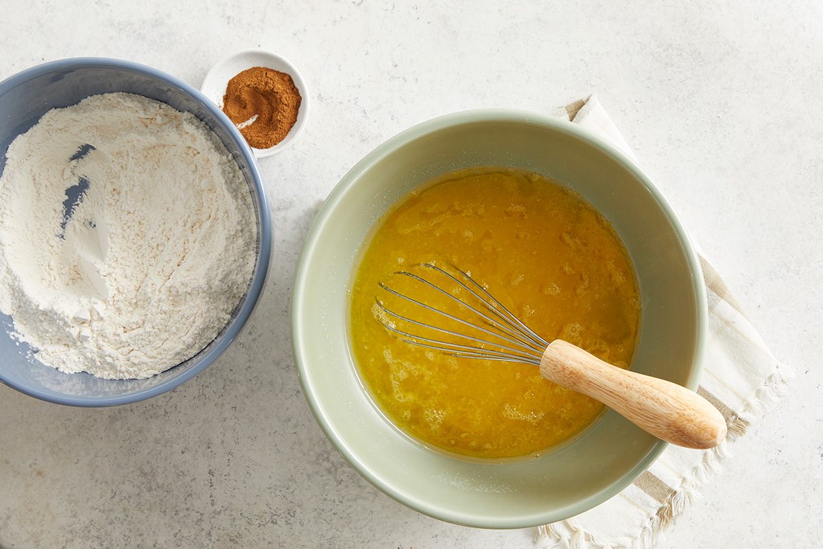 In a bowl, beat eggs, oil and sugar until smooth