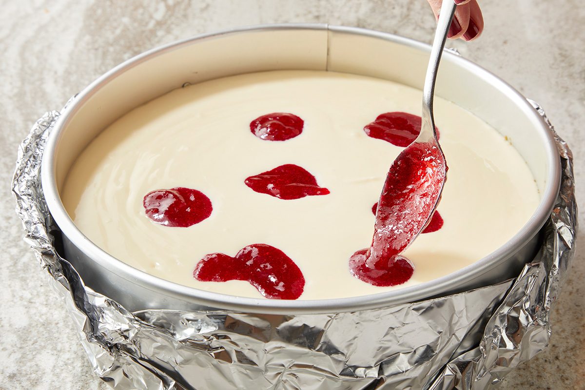 Pour into crust; Spoon quarter cup topping over filling