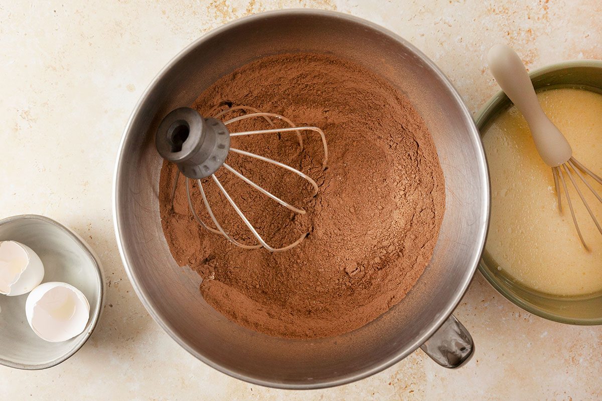 Dry ingredient being mixed in a bowl for making Dubai Chocolate Cake