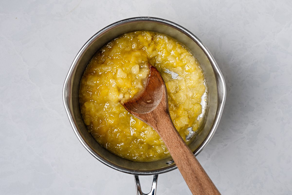 sugar, cornstarch, and pineapple with its juice combined in a small saucepan