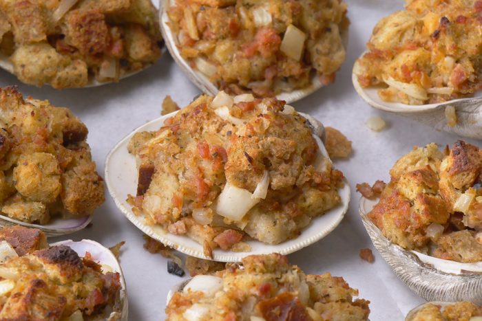 closeup shot of Rhode Island Stuffies are presented on a silver baking sheet lined with parchment paper